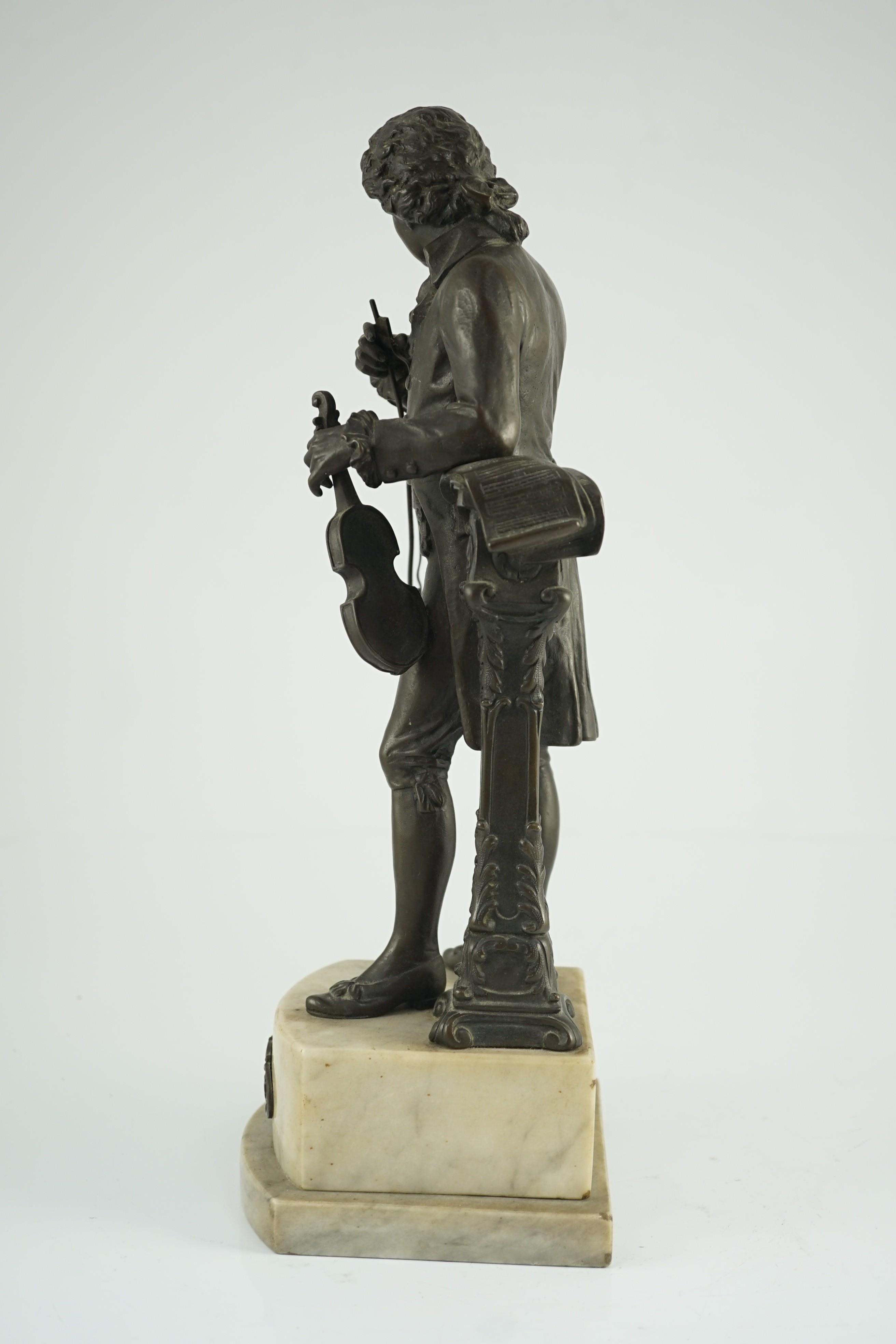 Carl Brose (German, 1880-). An early 20th century bronze figure of Mozart holding a violin, 41cm high